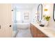 Bright bathroom with double vanities, soaking tub, and luxurious glass shower at 6711 Creft Cir, Lake Park, NC 28079