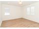 Bright bedroom with two windows and light wood floors at 6711 Creft Cir, Lake Park, NC 28079