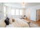 Spacious primary bedroom with hardwood floors, many windows, and a sitting area at 6711 Creft Cir, Lake Park, NC 28079