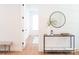 Hallway featuring modern decor, including a round mirror, sleek console table, and stylish accents at 6711 Creft Cir, Lake Park, NC 28079