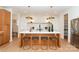 Modern kitchen with center island, bar stool seating, and ample cabinet space at 6711 Creft Cir, Lake Park, NC 28079