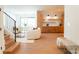 Open-concept living space with staircase, dining area and light wood floors at 6711 Creft Cir, Lake Park, NC 28079