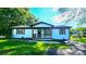 Charming, freshly painted home with well-maintained lawn and inviting front porch at 703 Central Nw Dr, Concord, NC 28027