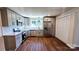 Modern kitchen features stainless steel appliances, light gray cabinets, and subway tile backsplash at 703 Central Nw Dr, Concord, NC 28027