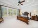Spacious bedroom with decorative trey ceiling, large windows, carpet flooring and a ceiling fan at 7150 Irongate Dr, Indian Land, SC 29707