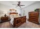 Comfortable bedroom with warm lighting, decorative furniture, and comfortable bedding at 7150 Irongate Dr, Indian Land, SC 29707