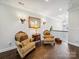 Elegant hallway sitting area with hardwood floors and detailed sconces at 7150 Irongate Dr, Indian Land, SC 29707