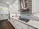 Well-appointed kitchen with stainless steel appliances and a unique mosaic tile backsplash at 7150 Irongate Dr, Indian Land, SC 29707