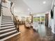 Spacious living room with stairs, hardwood floors, and an open floor plan at 7150 Irongate Dr, Indian Land, SC 29707