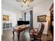Well appointed office space with a built-in bookcase and comfortable furniture at 7150 Irongate Dr, Indian Land, SC 29707