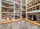 Walk-in pantry with custom shelving and ample storage space for kitchen essentials at 7150 Irongate Dr, Indian Land, SC 29707