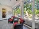 Relaxing sunroom featuring ample natural light and serene views of the backyard oasis at 7150 Irongate Dr, Indian Land, SC 29707