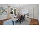 Elegant dining room with a large wood table, seating for six, chandelier and soft natural light at 726 E Kingston Ave, Charlotte, NC 28203