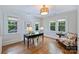 Bright office space with multiple windows, hardwood floors, and stylish decor at 726 E Kingston Ave, Charlotte, NC 28203