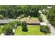 Wide aerial view of single-story home, expansive yard, detached garage, and surrounding neighborhood at 900 Nance St, Kannapolis, NC 28083
