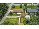 Overhead shot of home showcasing detached garage and spacious back yard with mature trees at 900 Nance St, Kannapolis, NC 28083