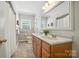 Well-maintained bathroom features a double vanity, and ample natural light, offering a comfortable space at 900 Nance St, Kannapolis, NC 28083