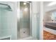Bathroom showcasing a glass-enclosed shower with vintage tile work and a view into the bedroom at 900 Nance St, Kannapolis, NC 28083