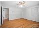 Bedroom featuring hardwood floors, closet doors, and door into an adjoining room at 900 Nance St, Kannapolis, NC 28083