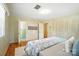 Bedroom with hardwood flooring, a patterned bedspread, and access to an adjoining bathroom at 900 Nance St, Kannapolis, NC 28083