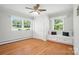 Bright bedroom with hardwood floors, large windows, and a built-in window seat with storage at 900 Nance St, Kannapolis, NC 28083