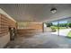 Spacious covered carport featuring an open design with brick accents and durable concrete flooring at 900 Nance St, Kannapolis, NC 28083