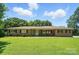 Charming single-story brick home featuring a large, well-maintained front yard and mature trees at 900 Nance St, Kannapolis, NC 28083
