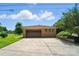 Detached two-car garage with neutral paint and a driveway, complementing the surrounding landscape at 900 Nance St, Kannapolis, NC 28083
