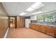 Kitchen features wood floors, ample cabinet space, marble-look countertops, and a large window at 900 Nance St, Kannapolis, NC 28083