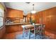 Warm kitchen offers a cozy breakfast nook and views of the rest of the house, blending functionality with comfort at 900 Nance St, Kannapolis, NC 28083