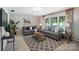 Inviting living room featuring large windows, comfortable seating, and modern decor elements at 900 Nance St, Kannapolis, NC 28083