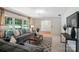 Bright living room with neutral tones, stylish furnishings, and a large window view, creating a relaxing ambiance at 900 Nance St, Kannapolis, NC 28083