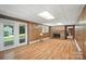 Spacious living room features wood-look floors, a brick fireplace, and double doors to the exterior at 900 Nance St, Kannapolis, NC 28083