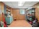 Storage room with vinyl floors, shelving, a work bench, and ample space at 900 Nance St, Kannapolis, NC 28083