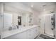 Bright bathroom features double vanity, a shower with glass doors, and ample lighting at 1010 Harry Ct, Albemarle, NC 28001