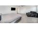 Bright bedroom features a ceiling fan, plush carpet, and natural light at 1010 Harry Ct, Albemarle, NC 28001