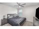 Bedroom with a ceiling fan, neutral colored walls and plush carpet at 1010 Harry Ct, Albemarle, NC 28001
