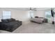 Spacious bedroom with a ceiling fan, plush carpet, and bright, natural light at 1010 Harry Ct, Albemarle, NC 28001