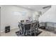 Open concept dining room with modern table, chairs, and dog kennel at 1010 Harry Ct, Albemarle, NC 28001