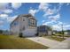 Attractive home with a two-car garage, green lawn, and well-maintained landscaping under a bright blue sky at 1010 Harry Ct, Albemarle, NC 28001