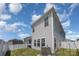 Exterior view of home with white vinyl siding and a manicured backyard at 1010 Harry Ct, Albemarle, NC 28001
