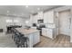 Spacious kitchen featuring a large granite island with seating and modern appliances at 1010 Harry Ct, Albemarle, NC 28001