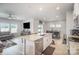 This open floor plan features the kitchen with a large island, granite countertops, and stainless steel appliances at 1010 Harry Ct, Albemarle, NC 28001