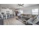 Open concept living area with modern kitchen, large gray sectional and many windows at 1010 Harry Ct, Albemarle, NC 28001