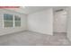 This bedroom offers natural light with neutral walls and carpet at 11139 Cardinal Creek Ave, Charlotte, NC 28215