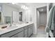 Bright bathroom with a double sink vanity, neutral color palette, and a large mirror for a modern, clean feel at 11246 Bartrams Way, Charlotte, NC 28278