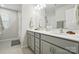 Elegant bathroom featuring double sinks, a large mirror, and neutral finishes for a spa-like feel at 11246 Bartrams Way, Charlotte, NC 28278