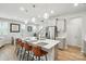 Open concept kitchen featuring an island with seating, and modern stainless steel appliances at 11246 Bartrams Way, Charlotte, NC 28278