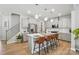 Stylish kitchen with gray cabinets, a quartz island, stainless steel appliances, and pendant lighting at 11246 Bartrams Way, Charlotte, NC 28278