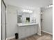 Bathroom featuring a double sink vanity with granite counters and modern lighting fixtures at 1140 Randall Ct, Concord, NC 28025